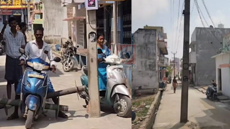 சாலையின் நடுவே மின்கம்பம் : இடமாற்றம் செய்ய பொதுமக்கள் கோரிக்கை